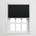 Black pleated cellular Blinds partially drawn on a white multi-pane window frame against a plain white wall