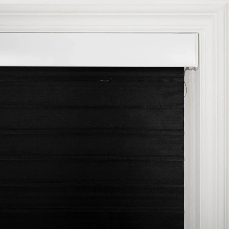 Black horizontal fabric window Blinds featuring a white headrail and decorative white trim around the frame with a visible white pull cord on the right side