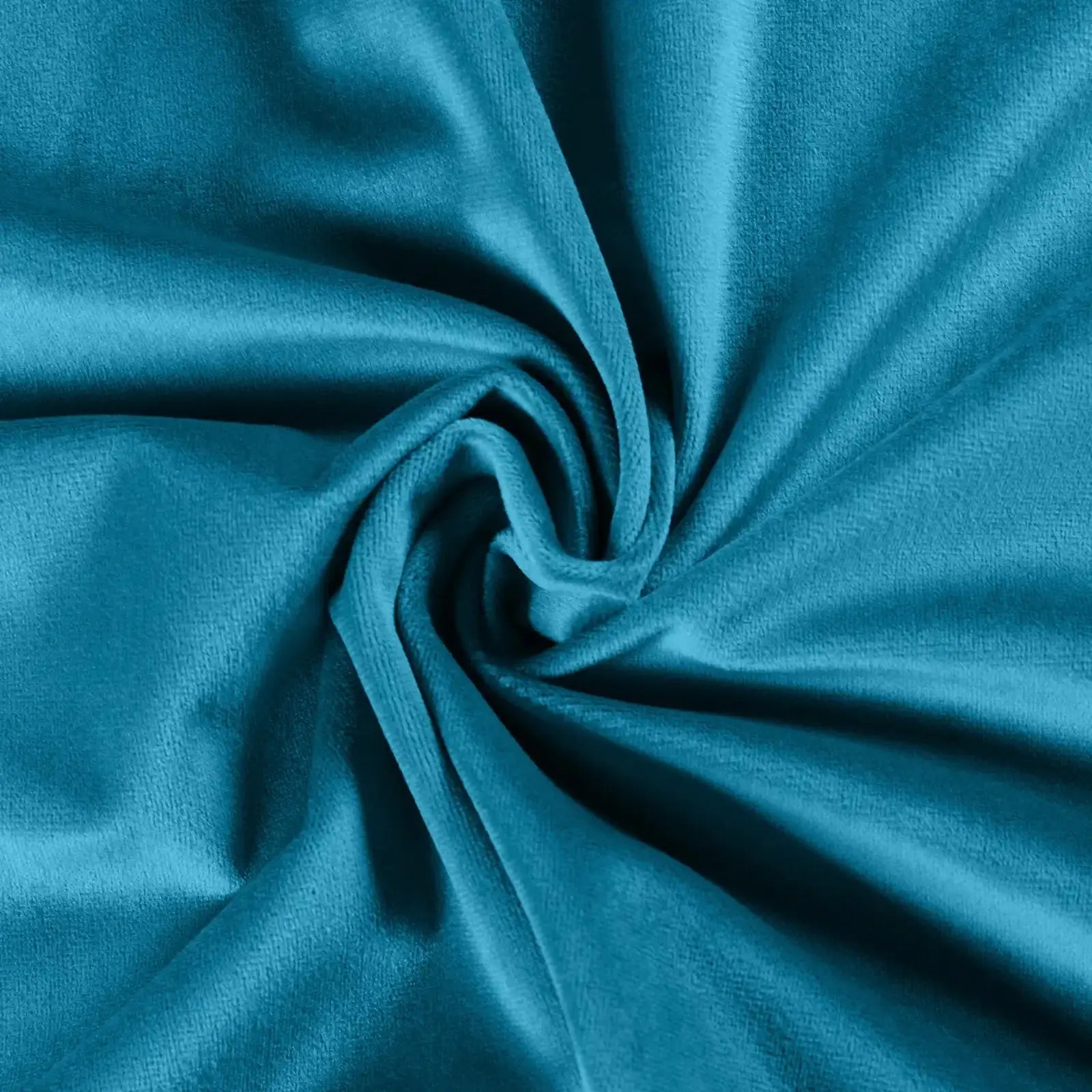 Teal velvet fabric featuring luxurious soft texture, vibrant color, and elegant swirling folds