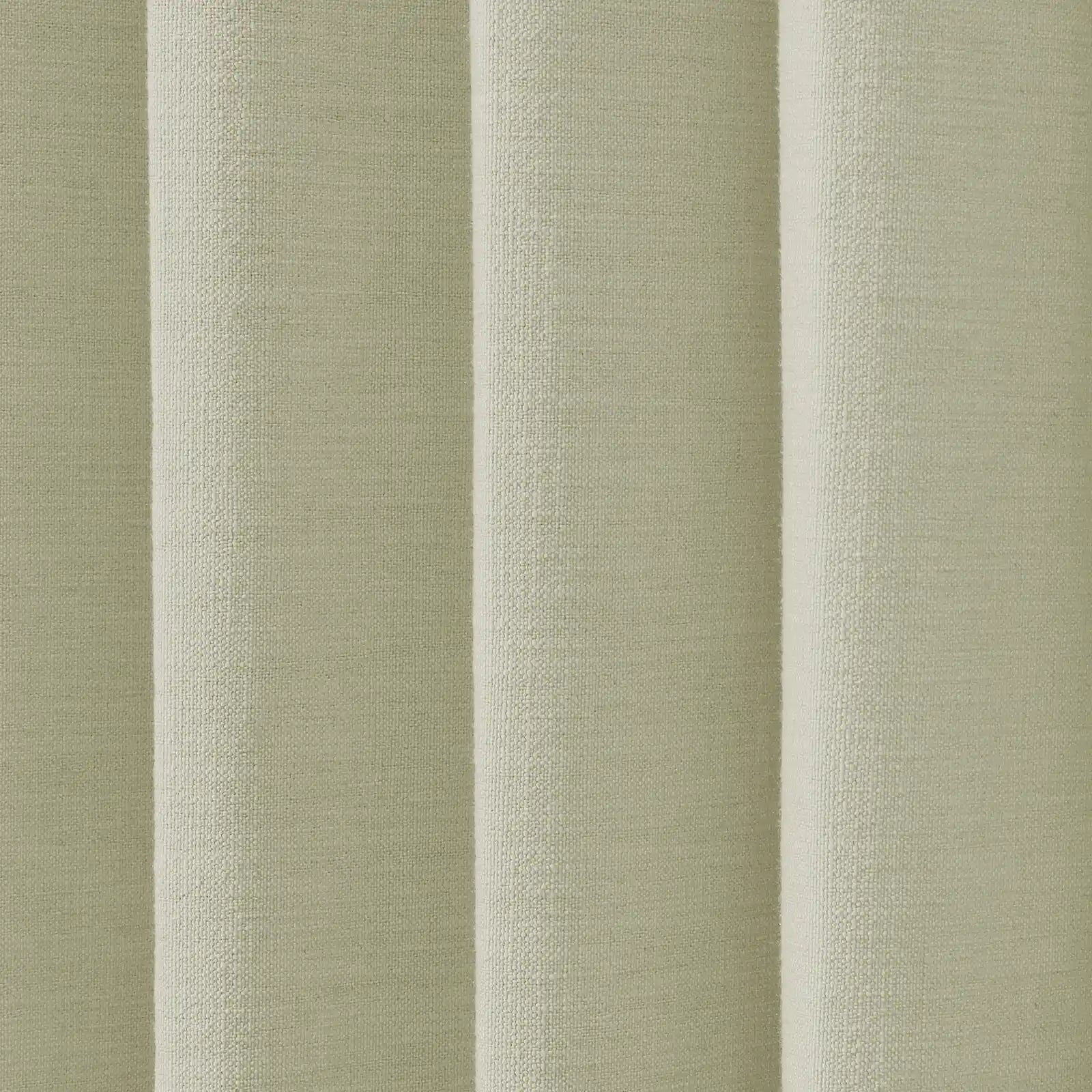 Textile of a pale sage green fabric with distinct vertical folds and a prominent nubbly woven texture