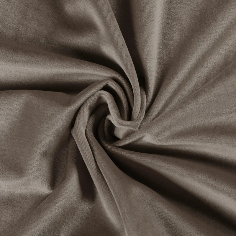 Muted taupe velvet fabric with a plush texture arranged in swirling folds showing a subtle play of light and shadow