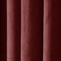 Deep burgundy velvet fabric showcasing its plush texture and soft vertical folds with subtle light and shadow play