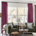 Burgundy Red Liz linen curtains framing a bright window in a balanced full-length interior view