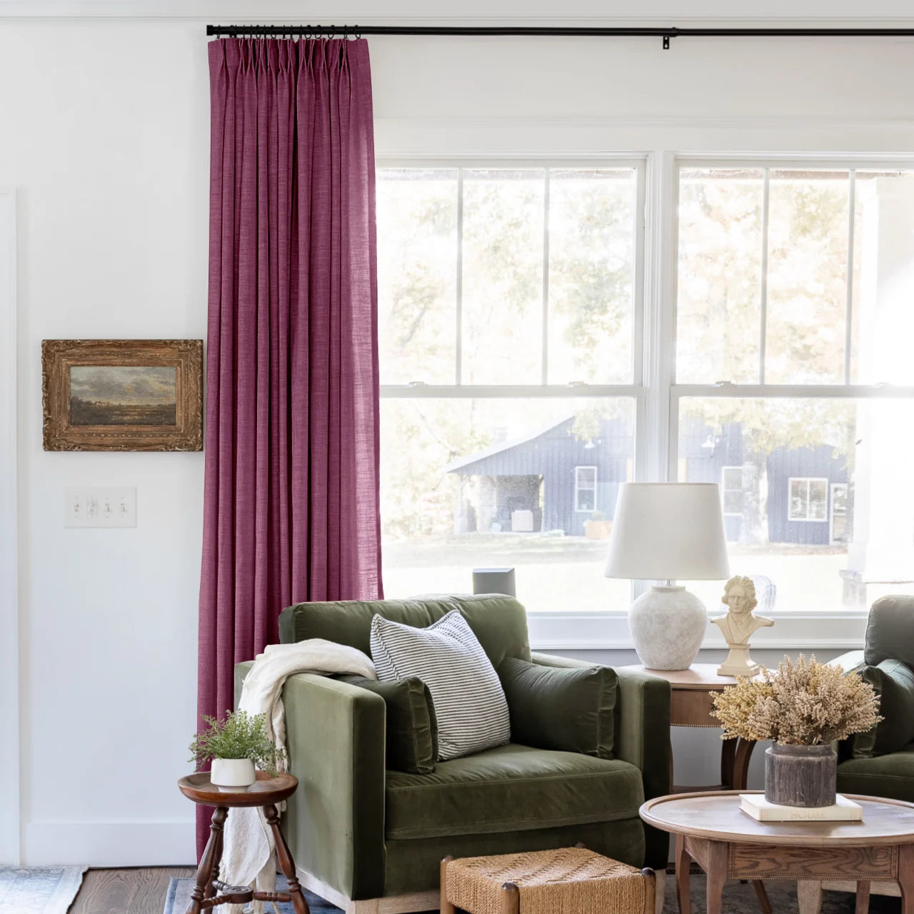 Burgundy Red Liz linen curtains shown closer beside a sunlit window with smooth vertical folds