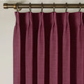 Burgundy Red Liz linen curtains viewed at an angle in a softly styled room with natural daylight