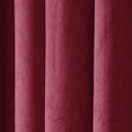 Photograph of rich maroon textured fabric with soft vertical drapes creating subtle shadows