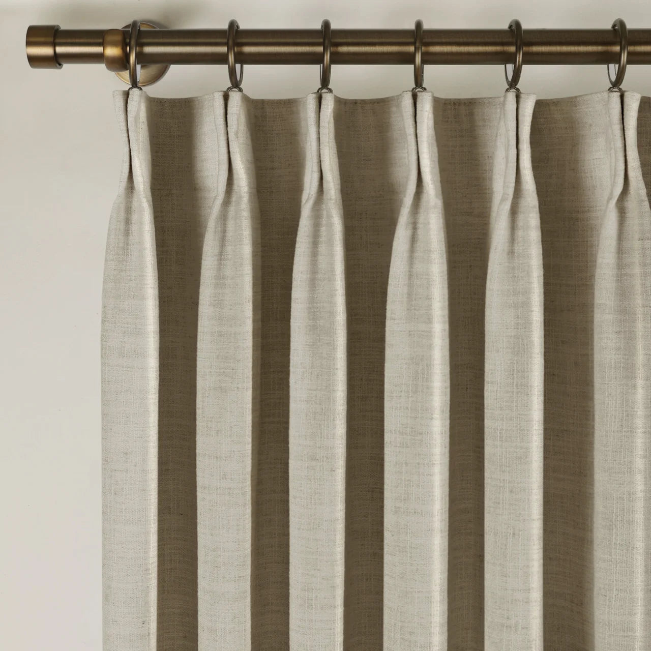 Burlywood Birch Liz Linen Pleated Curtains triple pinch pleat heading on a bronze curtain rod