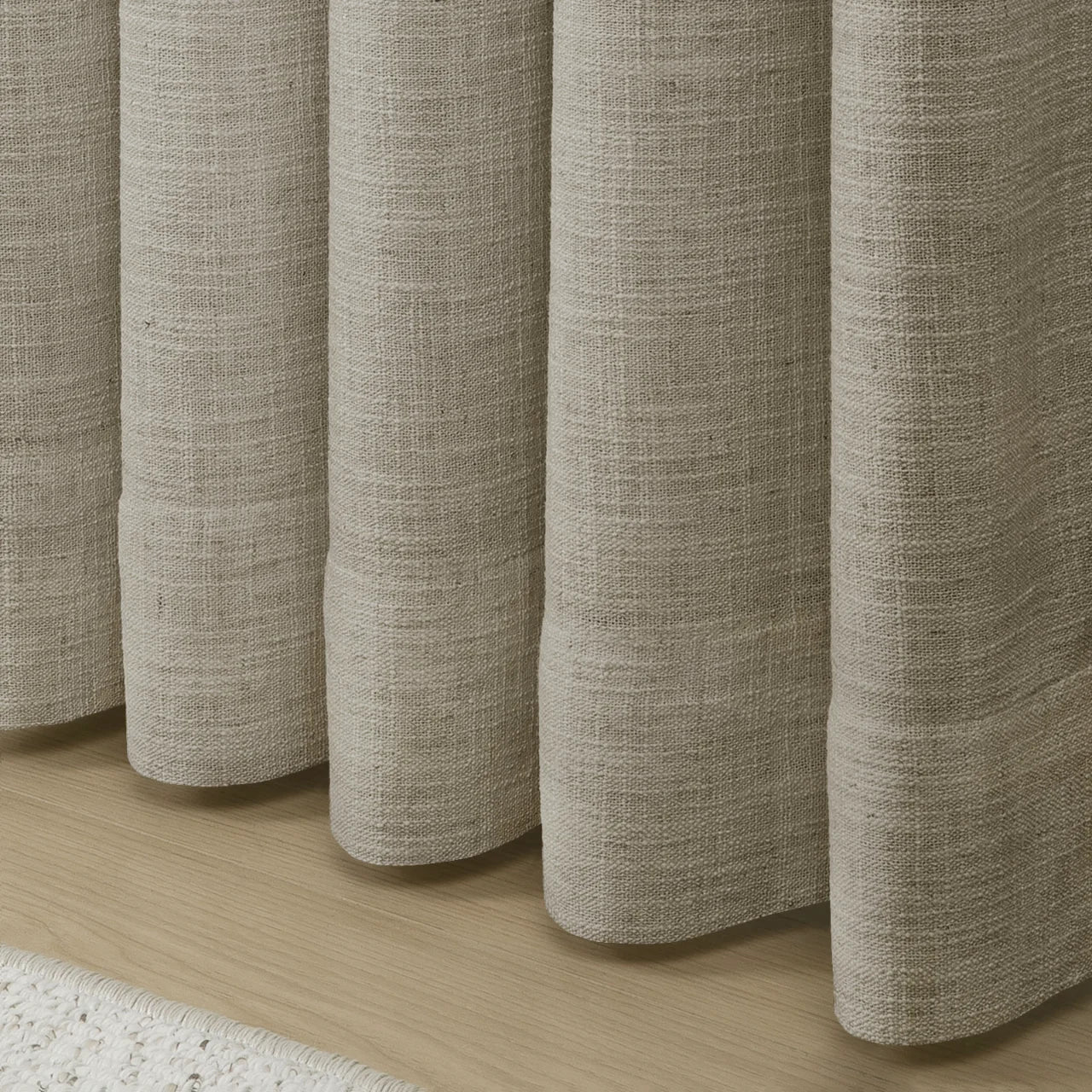 Burlywood Birch Liz Linen Pleated Curtains rounded curtain hems above a pale wood floor