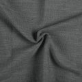Carbon Grey Liz linen curtains drawn partly across the window with filtered light revealing the weave
