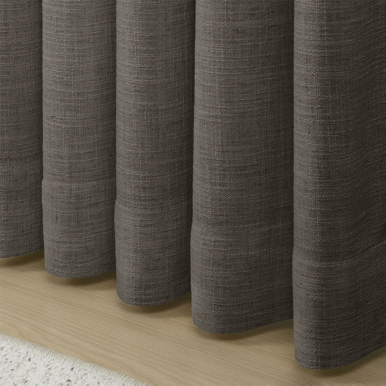 Chocolate Tart Liz linen curtains showing the lower drape and pooling folds near the floor