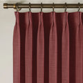 Cinnabar Liz linen curtains viewed at an angle in a softly styled room with natural daylight