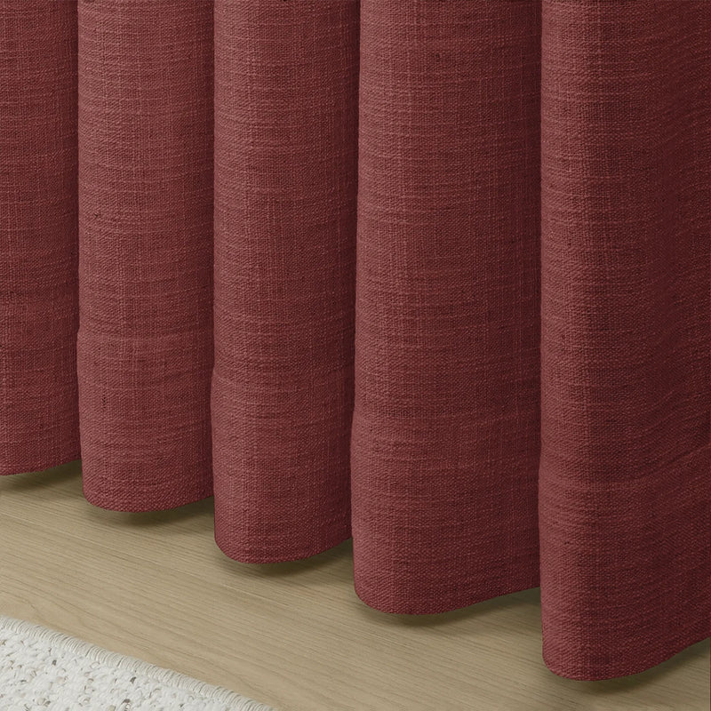 Cinnabar Liz linen curtains showing the lower drape and pooling folds near the floor