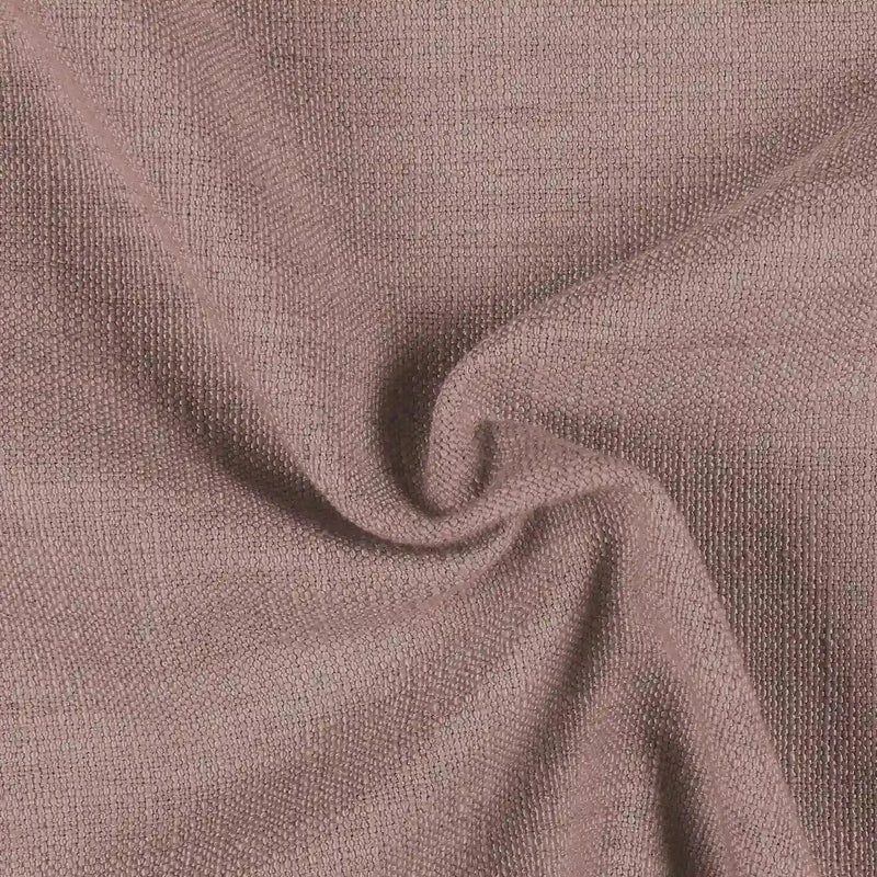 Textile image featuring a muted mauve-pink fabric with a visible slubby woven texture and soft undulating folds