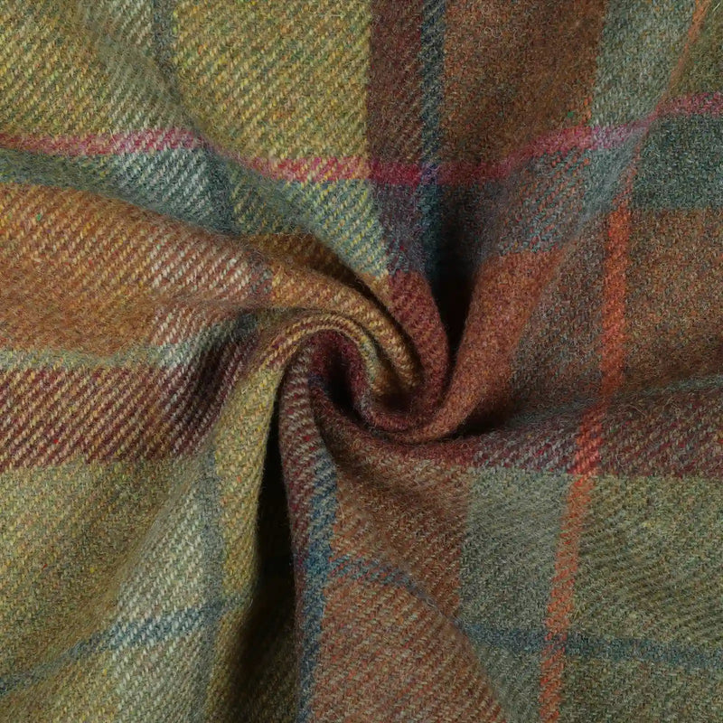 Tweed fabric with a complex plaid pattern woven in olive green, rustic orange, deep red, and subtle blue, showcasing a visible herringbone weave and soft fuzzy texture in gentle folds