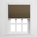 A brown cellular Blind partially covering a white six-pane window set into a clean white wall