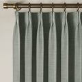 Dark Grey Liz linen curtains viewed at an angle in a softly styled room with natural daylight