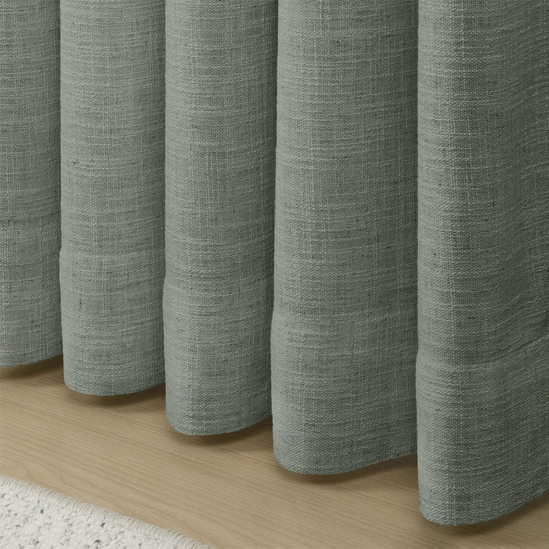 Dark Grey Liz linen curtains showing the lower drape and pooling folds near the floor