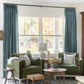 Everglade Teal Liz linen curtains framing a bright window in a balanced full-length interior view