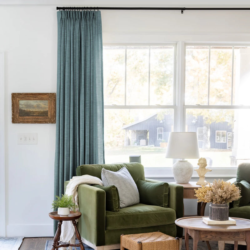 Everglade Teal Liz linen curtains shown closer beside a sunlit window with smooth vertical folds