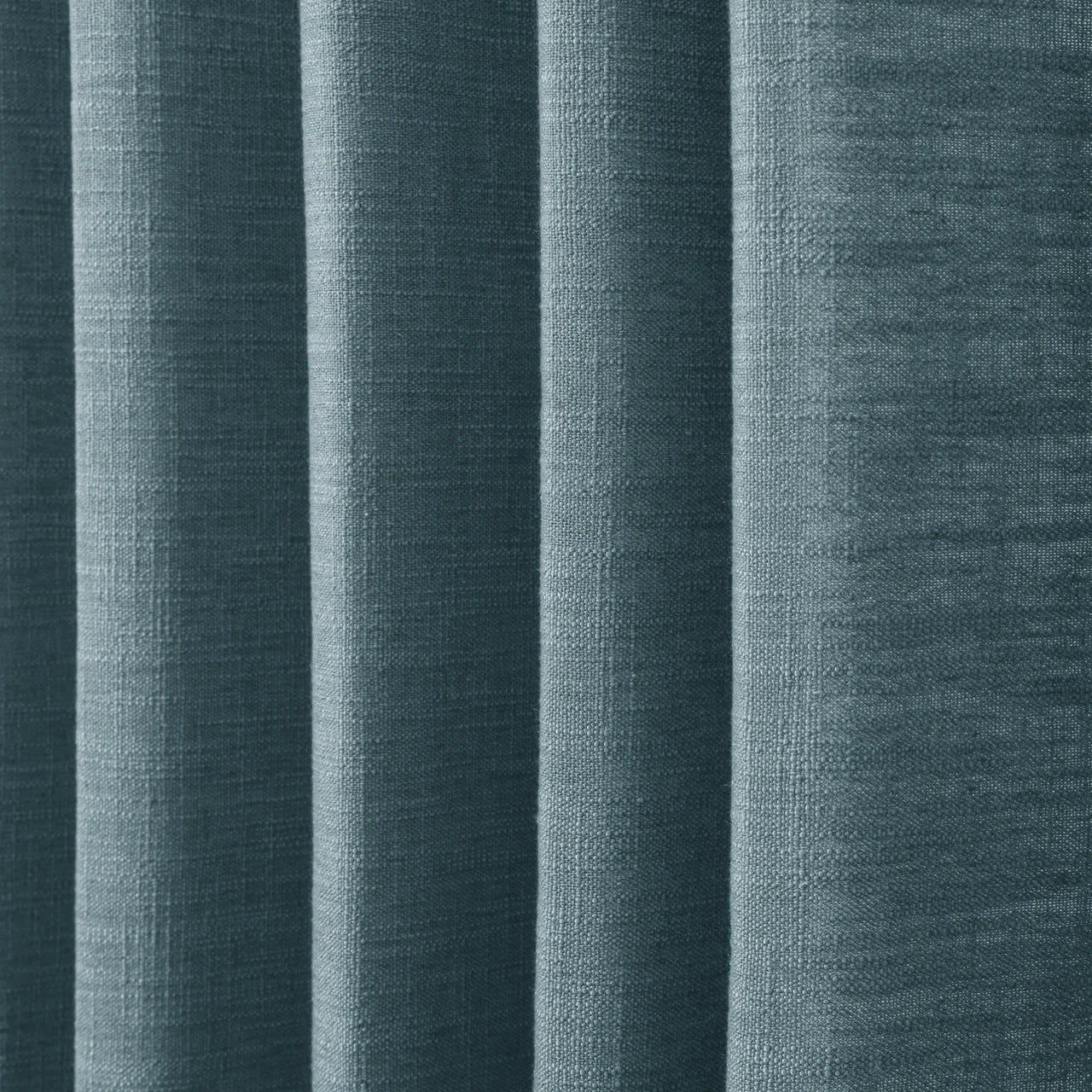 Everglade Teal Liz linen curtains in a close room detail highlighting the linen texture and colour