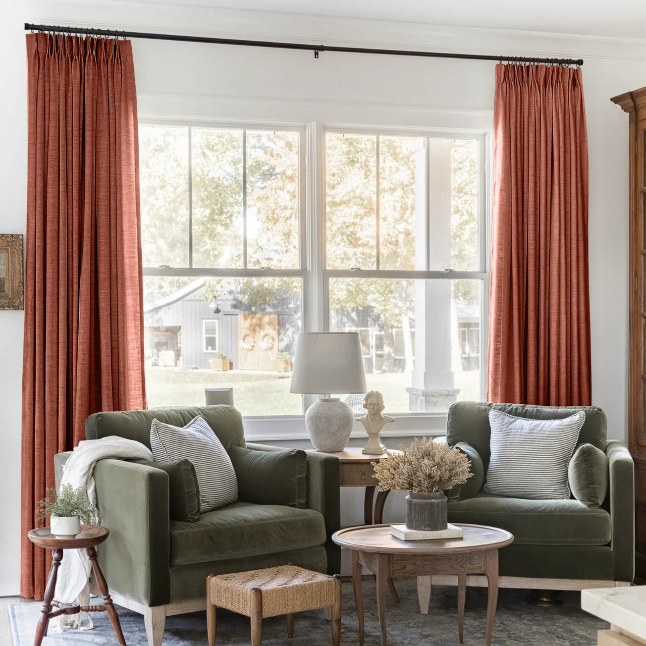 Firebrick Liz linen curtains framing a bright window in a balanced full-length interior view