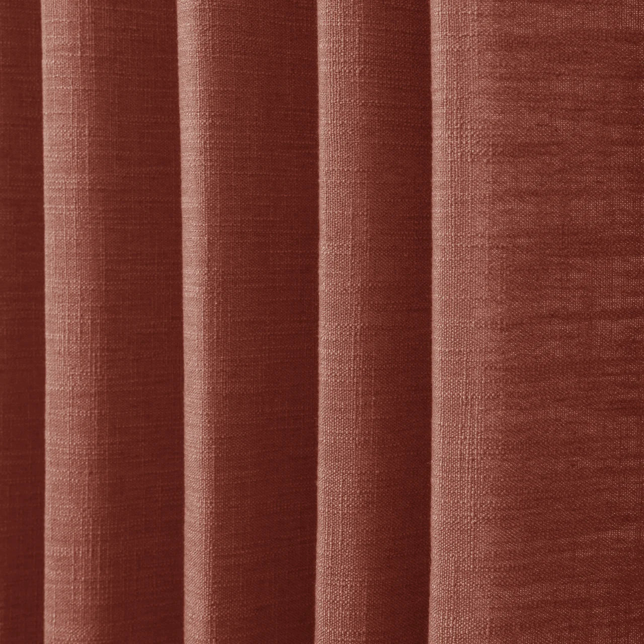 Firebrick Liz linen curtains in a close room detail highlighting the linen texture and colour