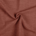 Firebrick Liz linen curtains drawn partly across the window with filtered light revealing the weave