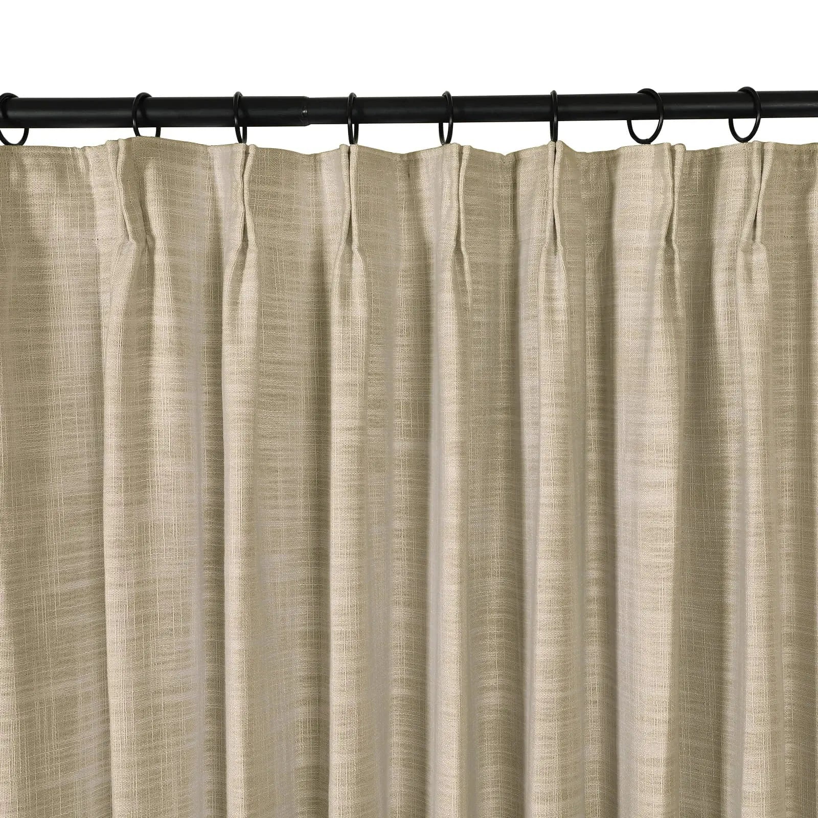 A single beige textured pinch pleat curtain panel hangs from a black rod with matching rings on a white background