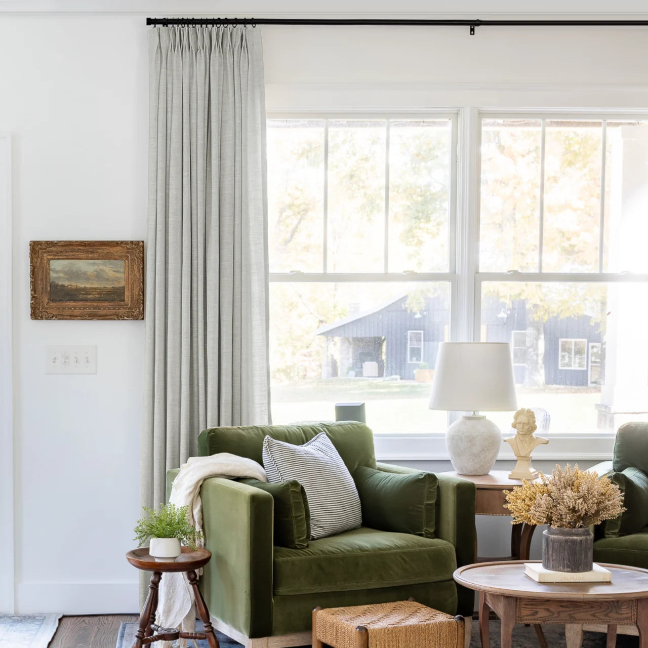 Fog Liz linen curtains shown closer beside a sunlit window with smooth vertical folds
