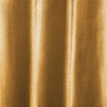 Photograph of shimmering golden bronze textile with elegant vertical folds creating lustrous highlights and subtle woven texture