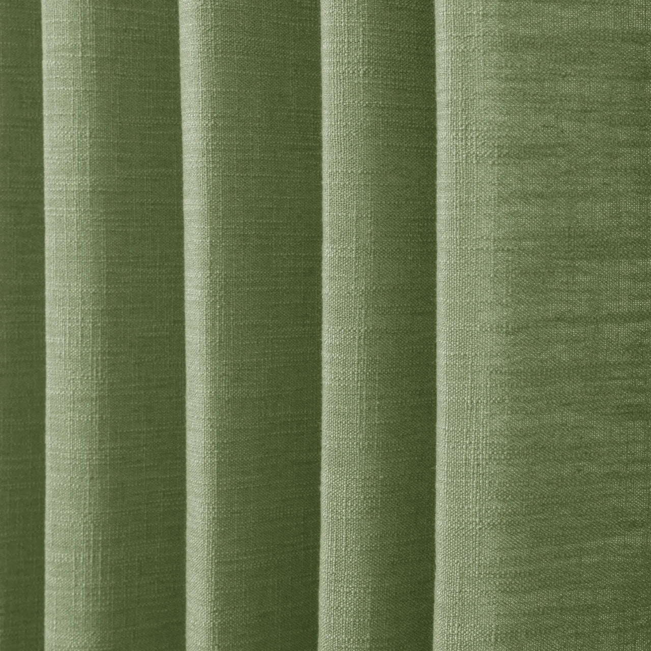 Green Liz linen curtains in a close room detail highlighting the linen texture and colour