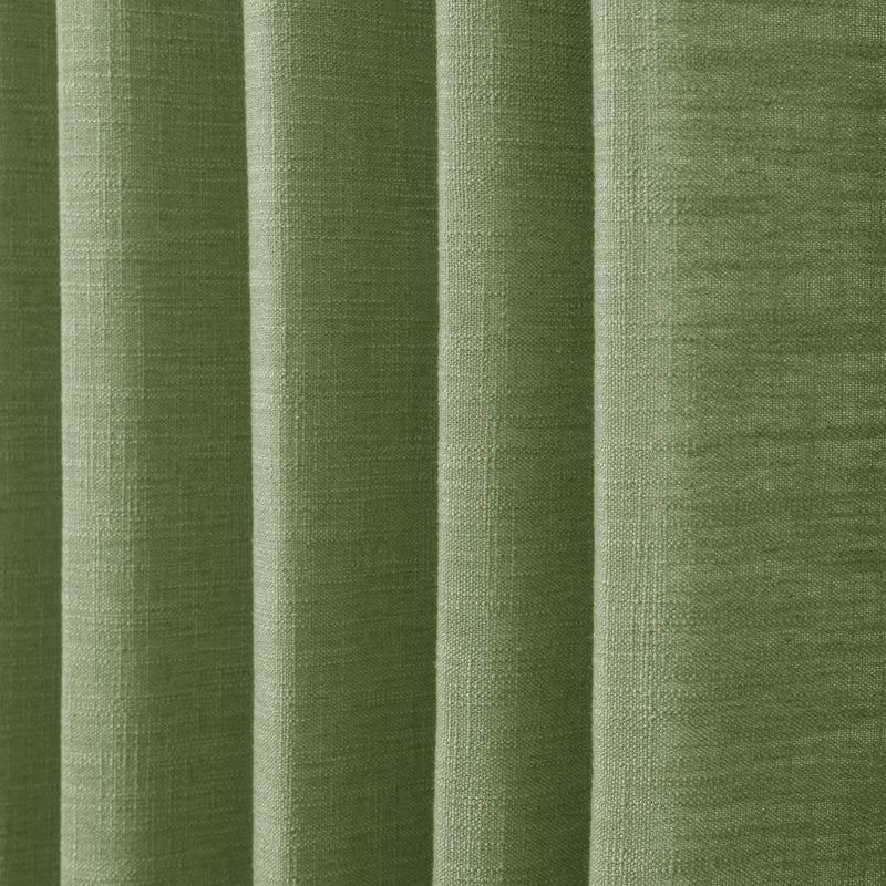 Green Liz linen curtains in a close room detail highlighting the linen texture and colour