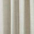 Close-up of a natural beige linen-look fabric curtain with soft vertical folds and a subtle woven texture