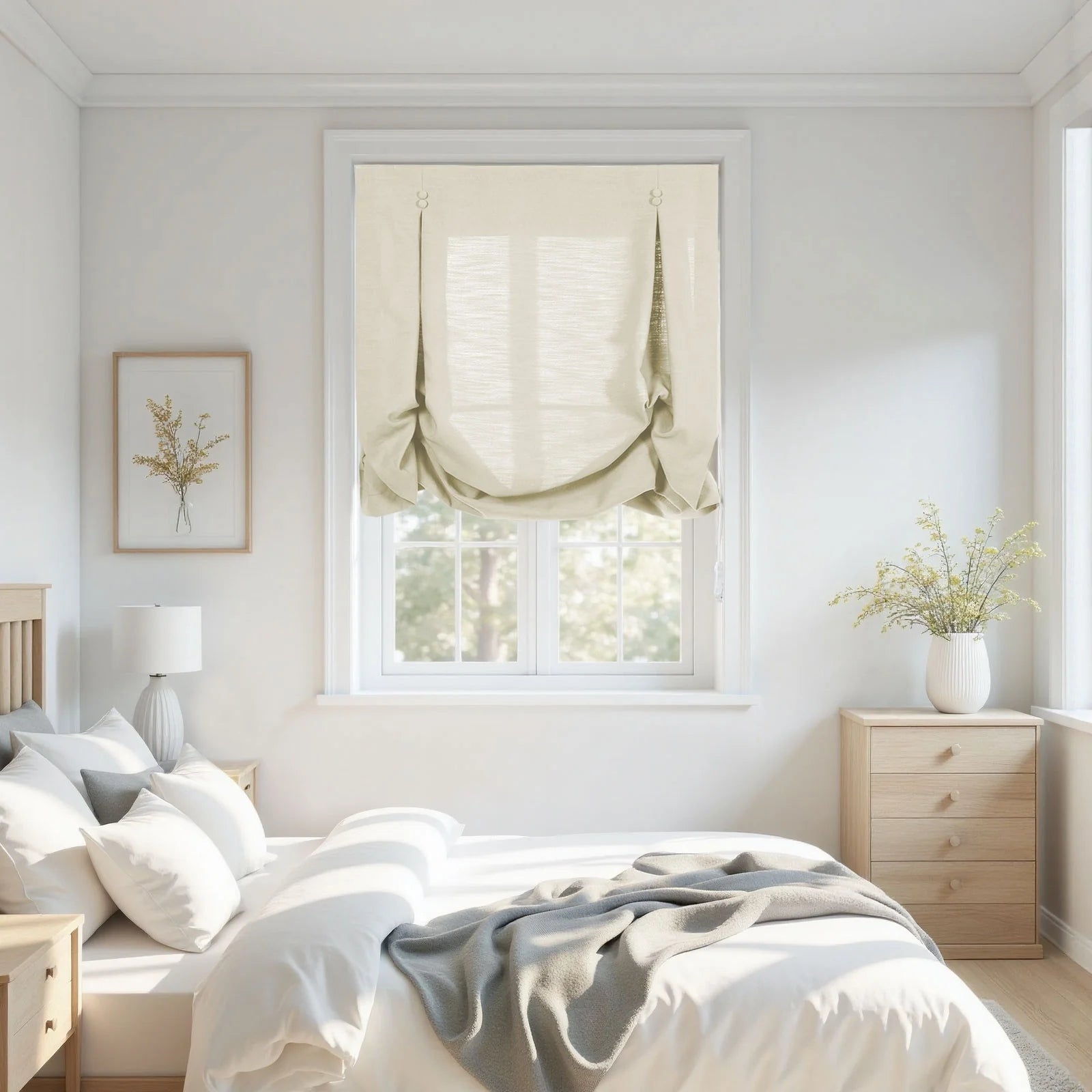 A bright minimalist bedroom interior features a window with a gathered beige balloon shade, light wood furniture, and a white bed with a grey throw