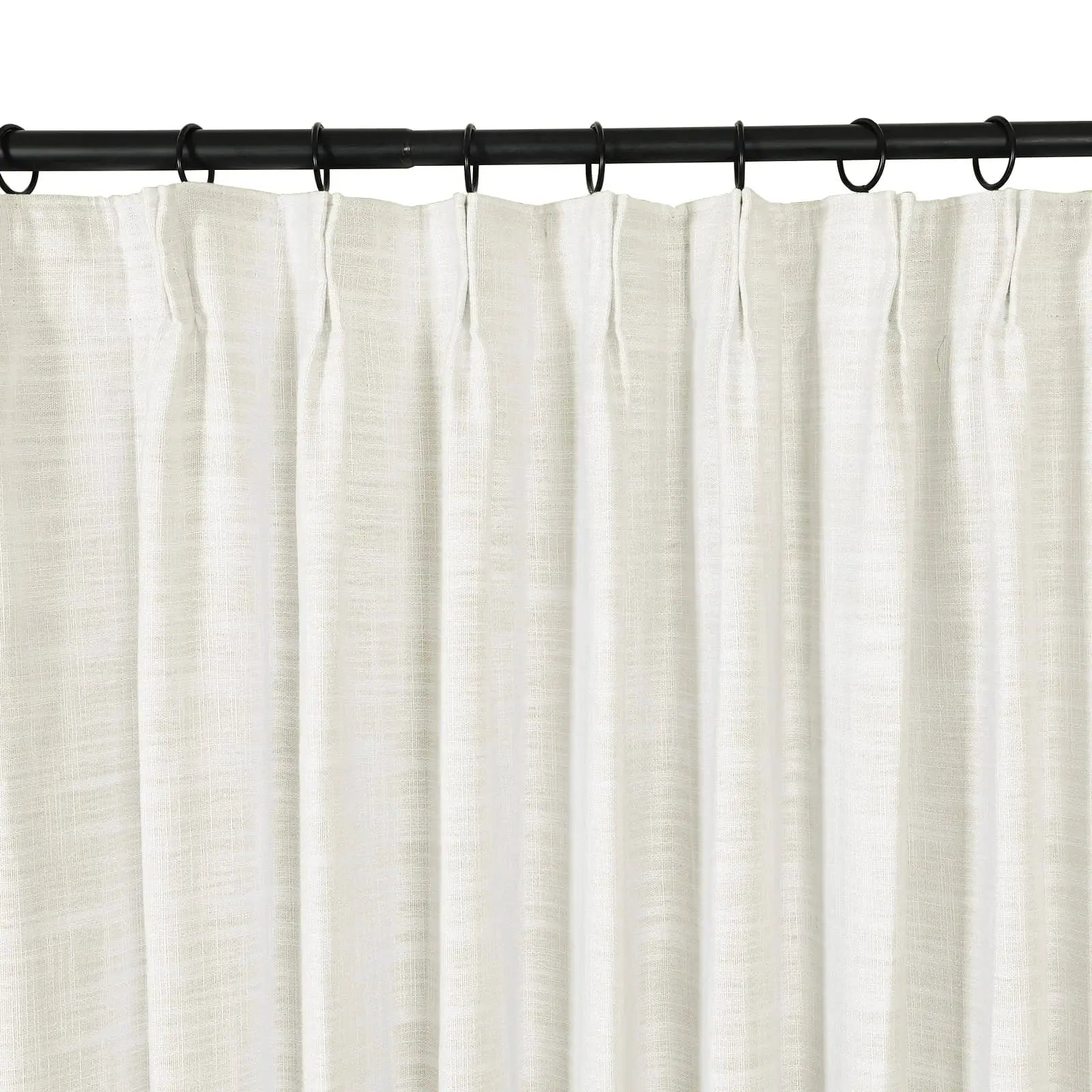 Photograph of a white sheer linen curtain with a subtle texture and pleated header suspended from a black metal curtain rod with rings