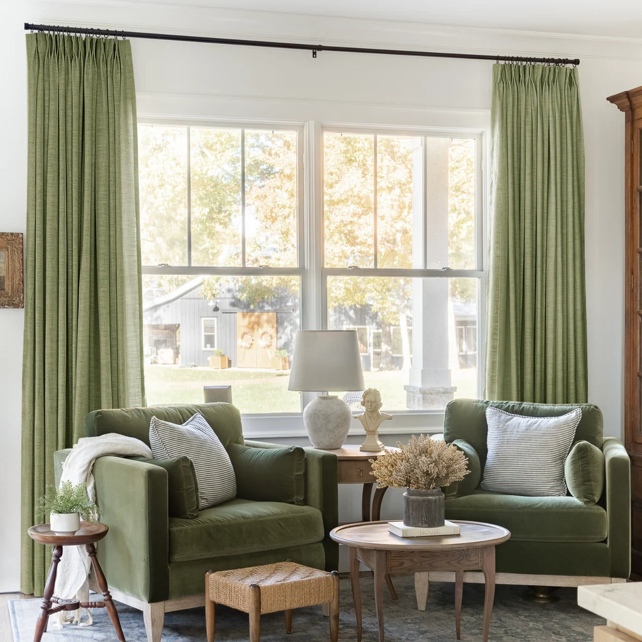 Jade Green Olive Liz linen curtains framing a bright window in a balanced full-length interior view