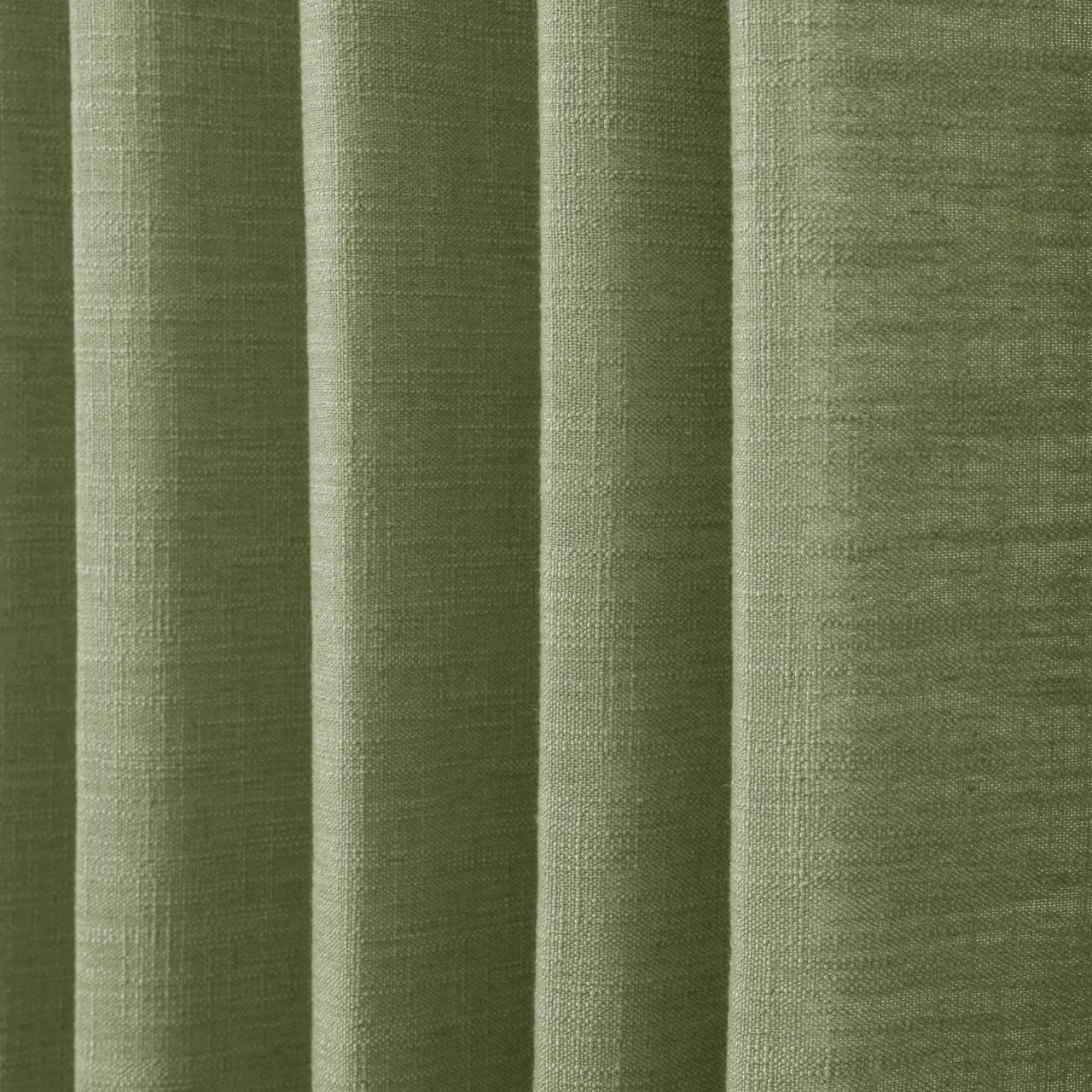 Jade Green Olive Liz linen curtains in a close room detail highlighting the linen texture and colour