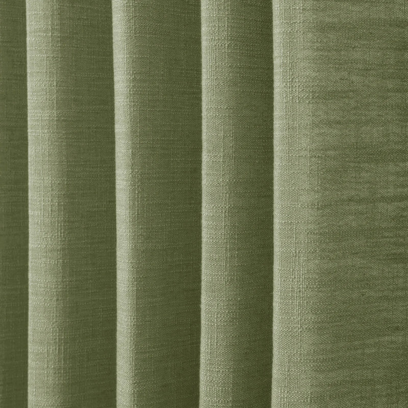Jade Green Olive Liz linen curtains in a close room detail highlighting the linen texture and colour