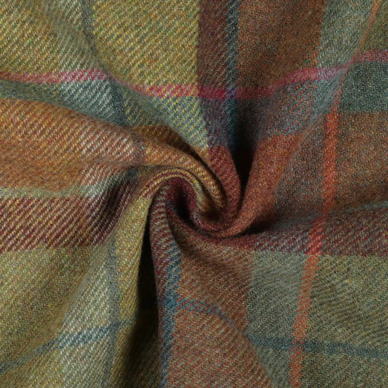 Woolen tweed fabric displaying a rustic plaid pattern featuring squares of moss green, russet, and gold with thin accent lines of fuchsia, sky blue, and deeper brown in a visible twill weave, gently swirled to show its rich texture