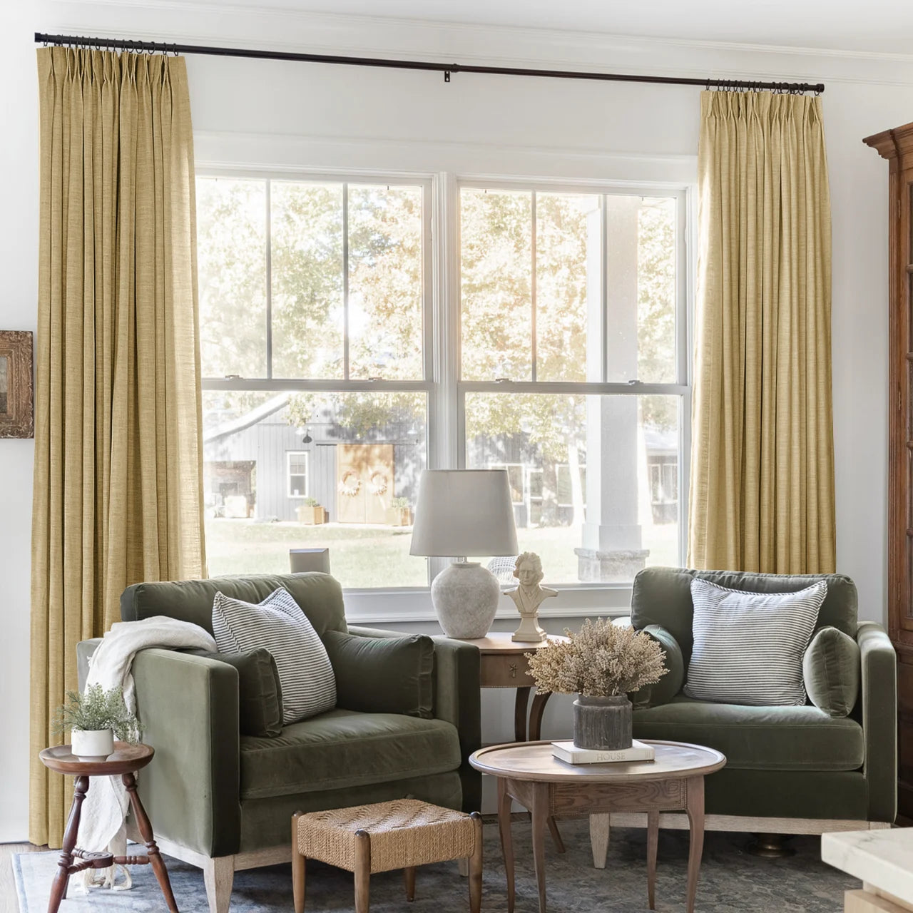 Khaki Liz linen curtains framing a bright window in a balanced full-length interior view
