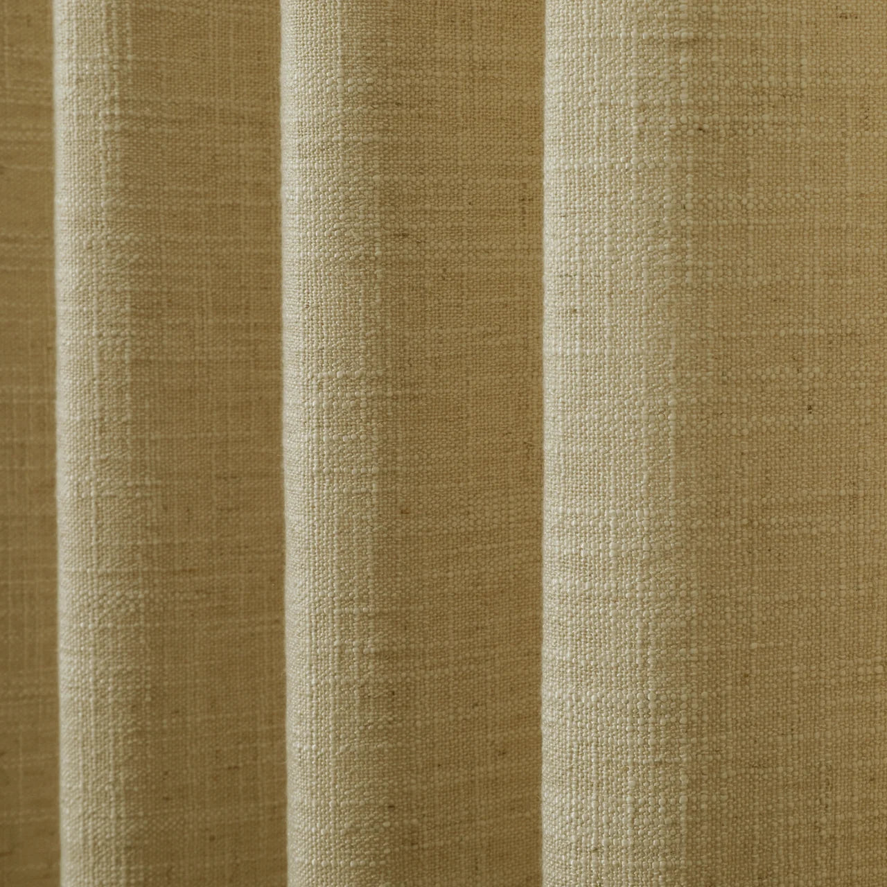 Khaki Liz linen curtains in a close room detail highlighting the linen texture and colour