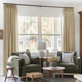 Khaki Yellow Liz linen curtains framing a bright window in a balanced full-length interior view