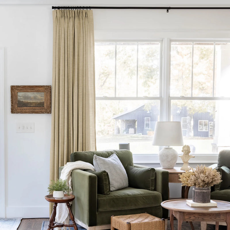 Khaki Yellow Liz linen curtains shown closer beside a sunlit window with smooth vertical folds