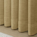 Khaki Yellow Liz linen curtains in a close room detail highlighting the linen texture and colour