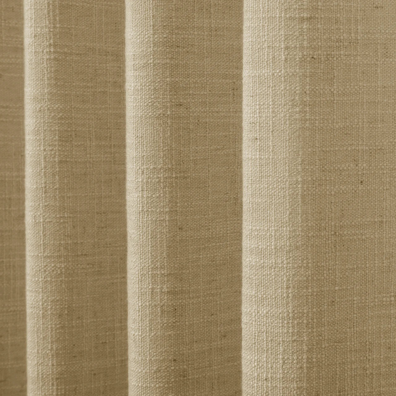 Khaki Yellow Liz linen curtains drawn partly across the window with filtered light revealing the weave