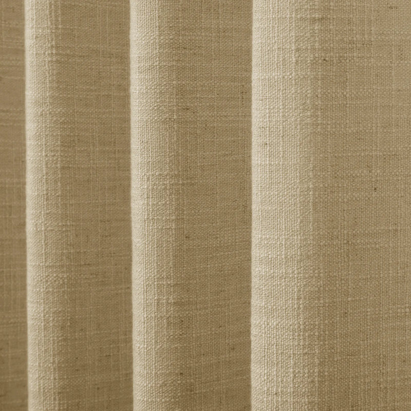 Khaki Yellow Liz linen curtains drawn partly across the window with filtered light revealing the weave