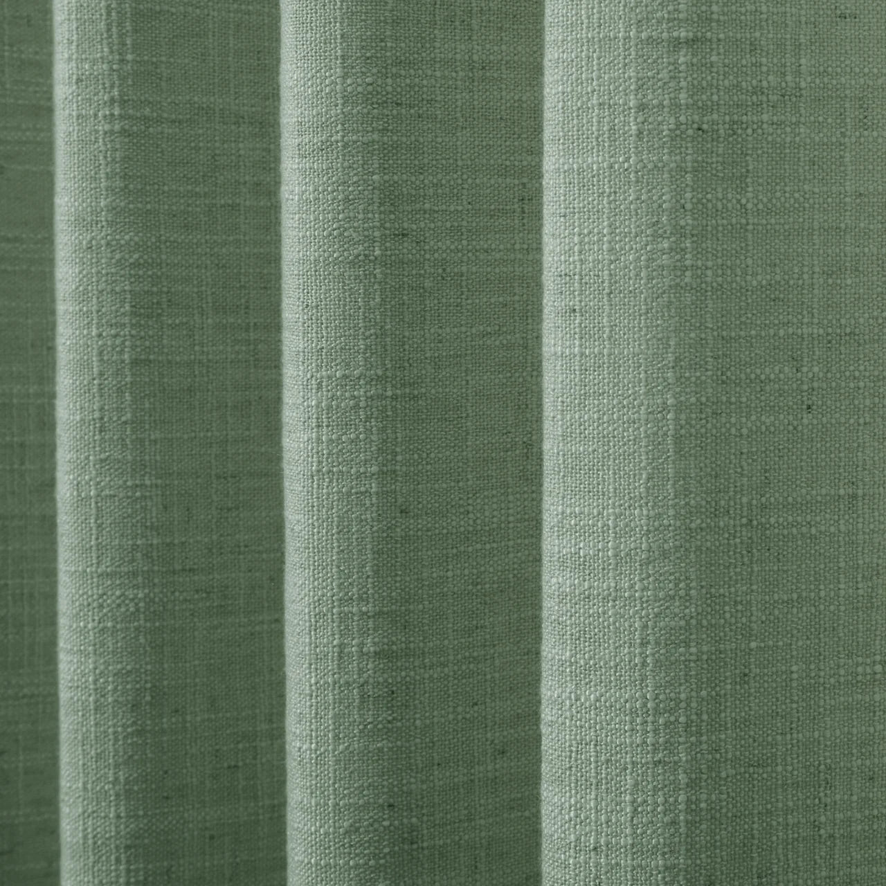 Lagoon Liz linen curtains drawn partly across the window with filtered light revealing the weave