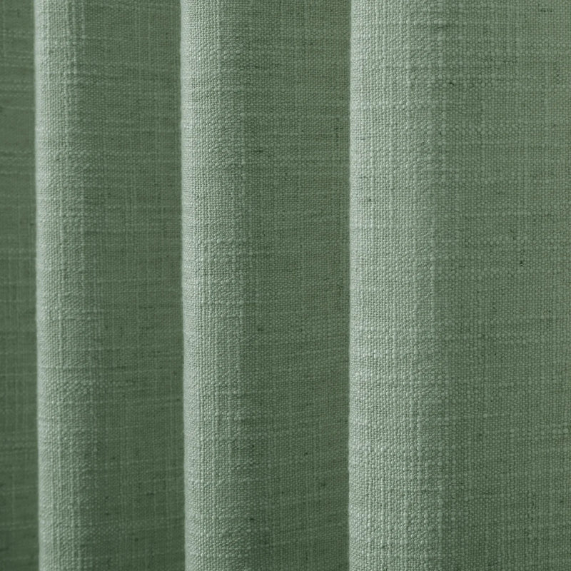 Lagoon Liz linen curtains drawn partly across the window with filtered light revealing the weave