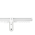 White aluminum curtain track system with a central mounting bracket and a line of D-shaped gliders