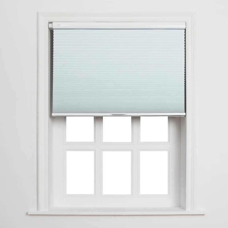 A light blue cellular pleated Blind partially unrolled over a white six-pane window with clean white trim